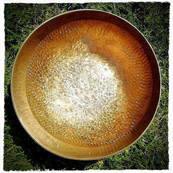 Singing bowl cymatic patterns in water