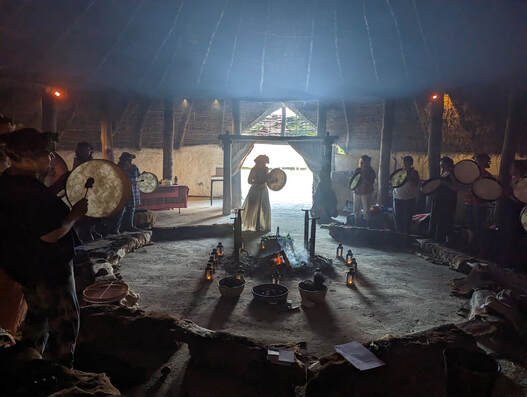 Drumming in Butser's Little Woodbury Roundhouse